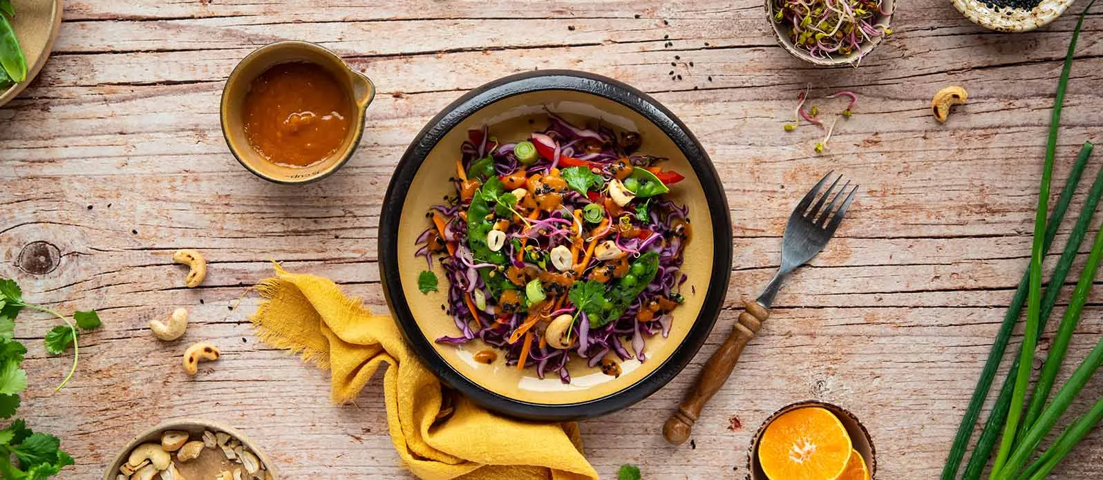 Red cabbage salad with cashews & peas