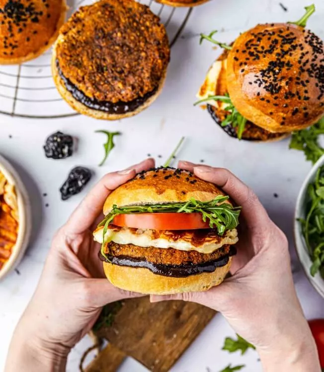 Lentil and bean burger with halloumi cheese and smoked plum BBQ sauce
