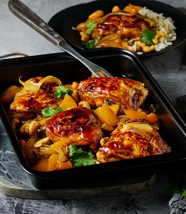 Marinated chicken thighs baked with cashews and peppers