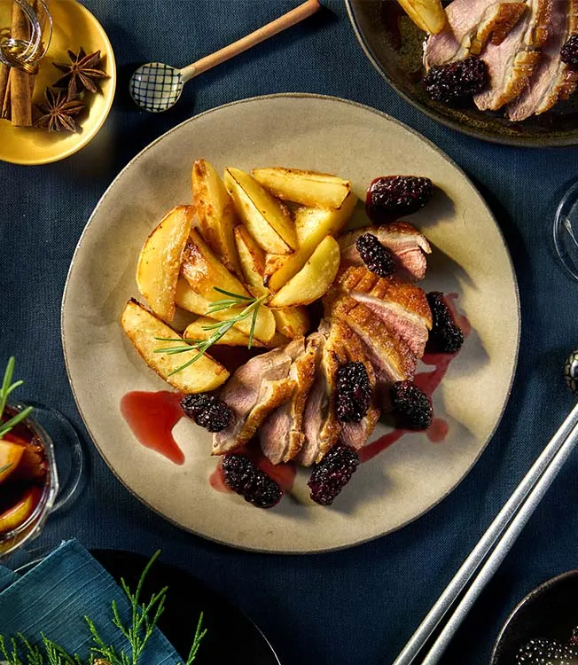 Duck breast with sweet blackberry sauce, baked potatoes with miso