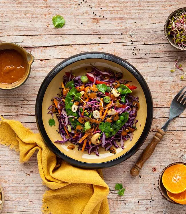Red cabbage salad with cashews & peas