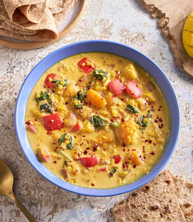 Moong dal with pumpkin, mango and coconut