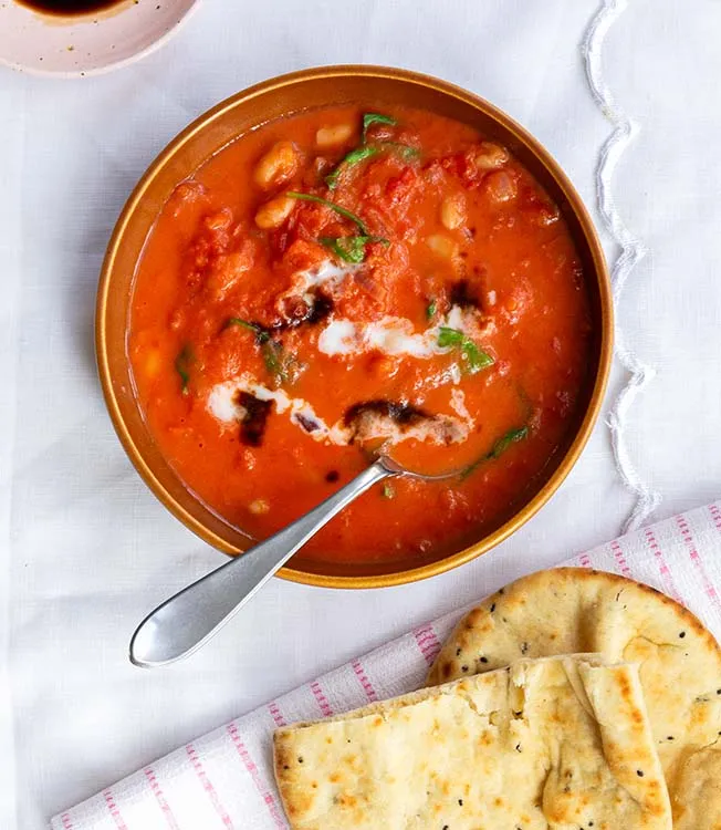 Creamy tomato stew with white beans and spinach