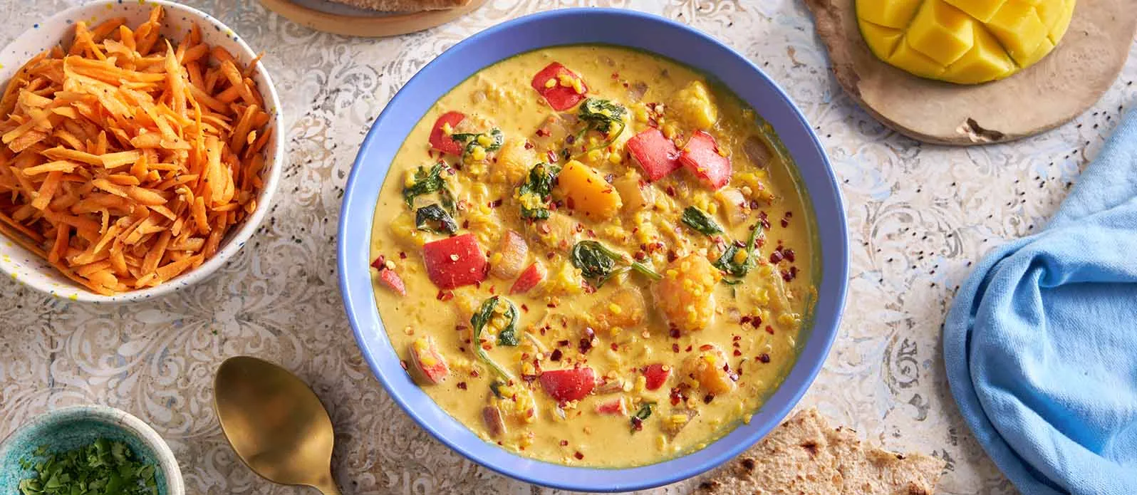Moong dal with pumpkin, mango and coconut