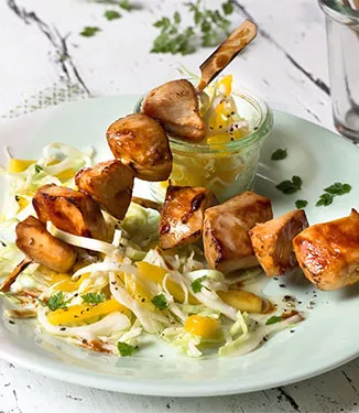 Chicken skewers with mango coleslaw