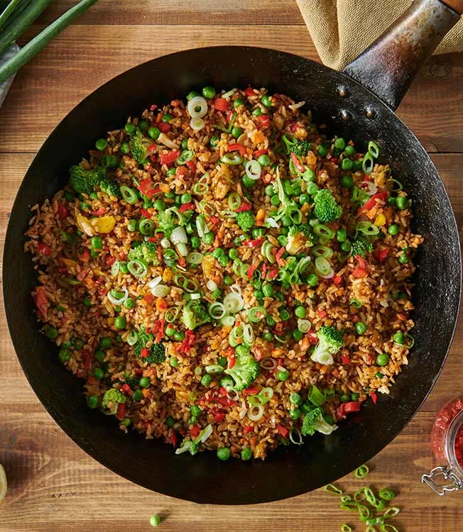 Spicy egg fried rice with vegetables & harissa