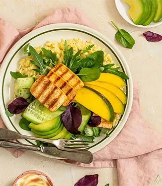 Salad with fried tofu, mango, avocado, cucumber and orzo noodles