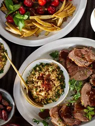 Slow-roasted lamb leg with orzo pilaf