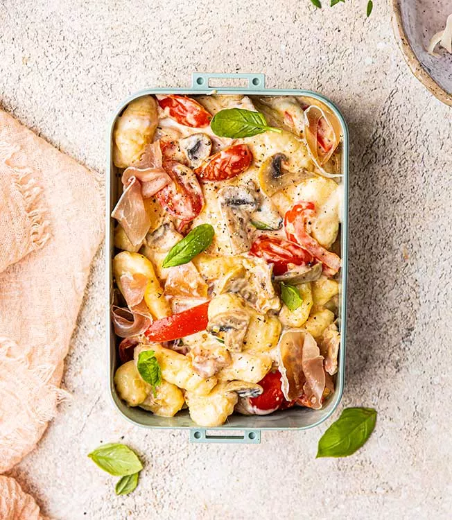 Gnocchi with prosciutto, peppers, mushrooms and cherry tomatoes with burrata