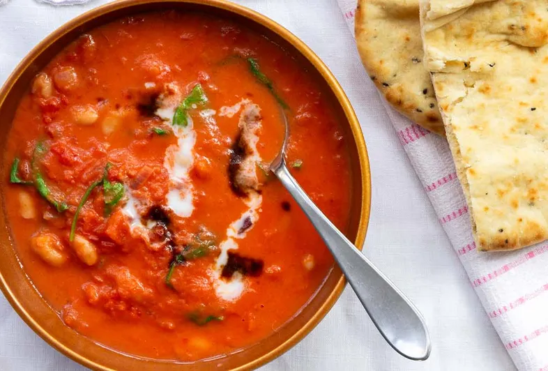 Creamy tomato stew with white beans and spinach