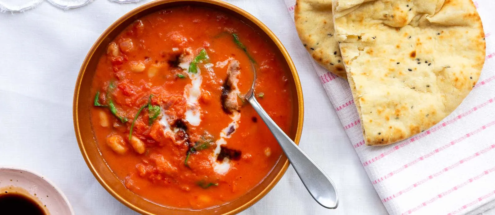 Creamy tomato stew with white beans and spinach