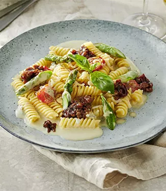 Fusilli with cheese sauce and soy sauce bolognese