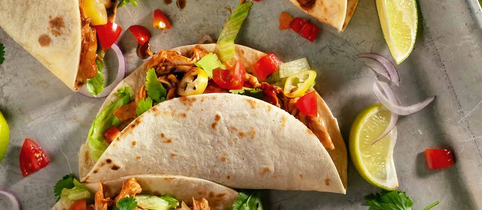 Orange pulled chicken tacos
