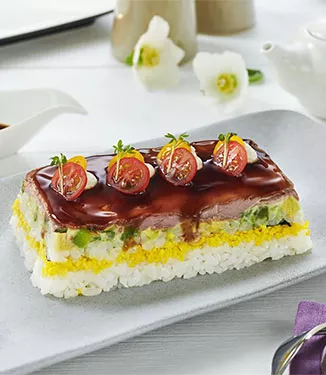 Sushi cake with roast beef and avocado