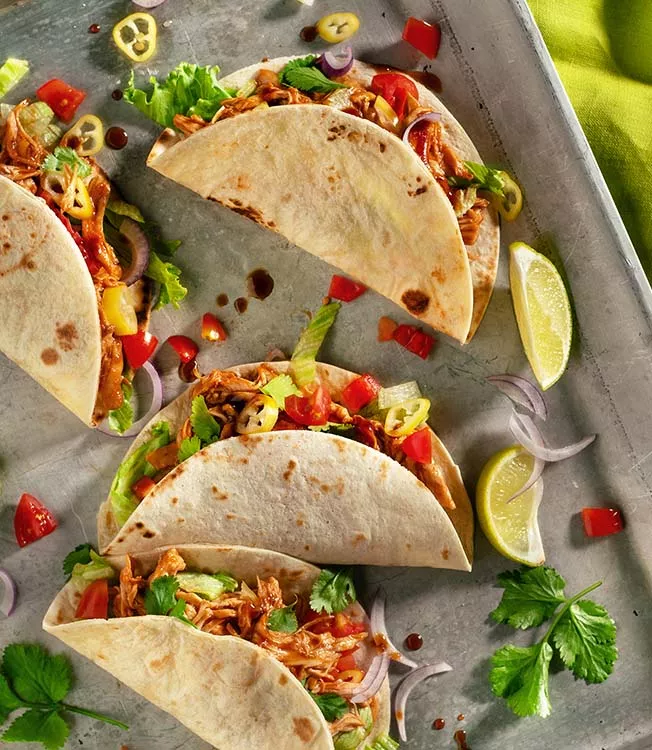 Orange pulled chicken tacos