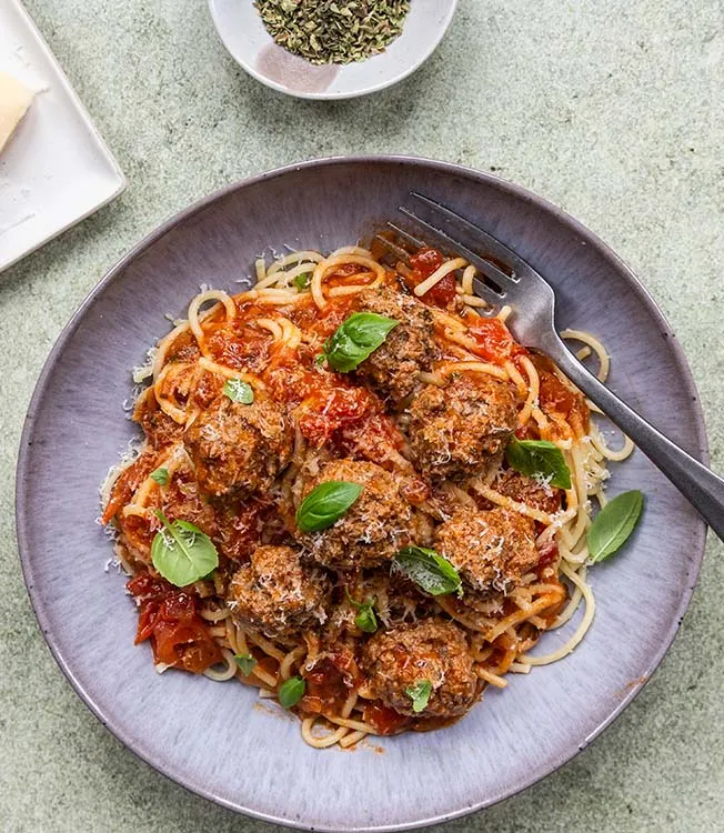 Asian spaghetti meatballs: Beef meatballs with garlic, soy, and basil in tomato sauce